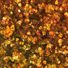 Nahaufnahme der Glorious Lights Glitter Palette mit funkelndem gold-orangefarbenem sechseckigem Glitzer mit schimmernden Highlights.