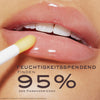Nahaufnahme glänzender Lippen mit einem Lippenapplikator; der Text hebt hervor, dass 95 % NUXE Honey Lip Care als feuchtigkeitsspendend empfanden.