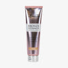 Rosa Tube der Loving Tan Bronze Shimmer Luminous Cream in der Variante „Medium“ mit silberfarbenem Klappverschluss.