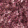 Nahaufnahme der Glorious Lights Glitter Palette mit funkelndem rosa und violettem Glitzer mit mehrfarbigen reflektierenden Partikeln.