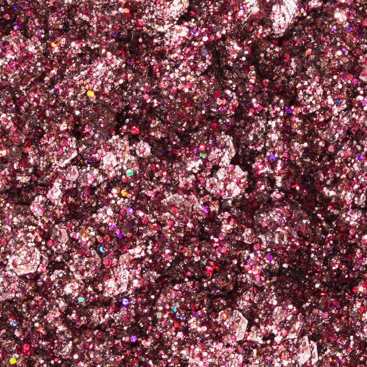 Nahaufnahme der Glorious Lights Glitter Palette mit funkelndem rosa und violettem Glitzer mit mehrfarbigen reflektierenden Partikeln.