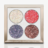 Die Miami Lights Glitter Palette ist ein goldverziertes Lidschattenset mit vier Farbtönen in den Glitzertönen Weiß, Rot, Lila und Bronze.