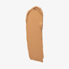 Ein Farbstreifen Chroma Cover Foundation Matte in der Farbe W7 auf weißem Hintergrund.