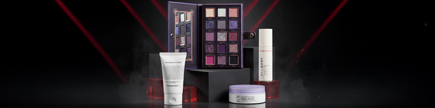 Vier Hautpflegeprodukte und eine offene Lidschattenpalette auf einem dunklen Hintergrund mit roten Lichtstrahlen.