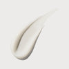 Ein weißer Klecks des N°3 Hair Perfector von OLAPLEX auf weißem Hintergrund.