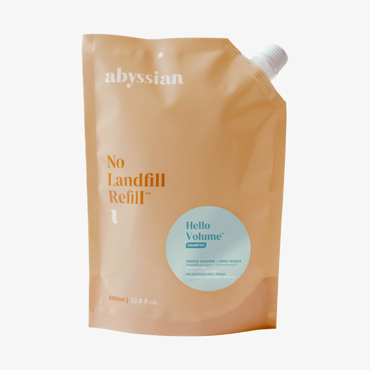 Nachfüllbeutel in Pfirsichfarbe des „Abyssian Hello Volume Hair Loss Shampoo“ mit weißem Verschluss in der rechten oberen Ecke.