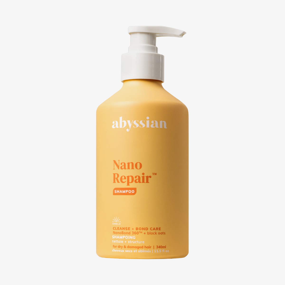 Abyssian Nano Repair Shampoo in einer gelben Flasche mit weißer Pumpe und weißem Etikettentext.