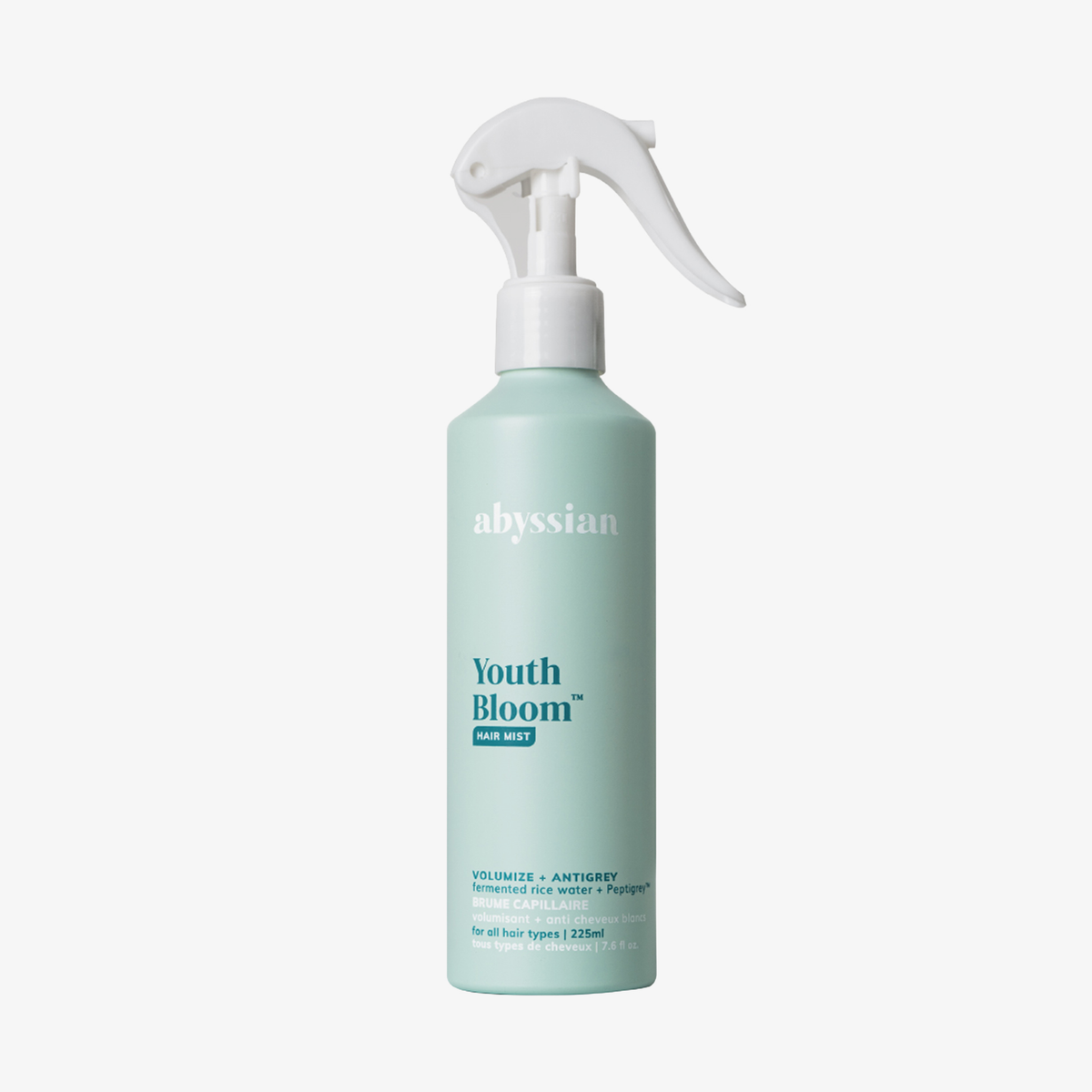 Abyssian Youth Bloom Hair Mist in einer hellblauen Sprühflasche mit weißer Sprühdüse vor weißem Hintergrund.