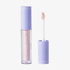 Eine geöffnete Tube BLONDESISTER GLOWEYE EYESHADOW mit lavendelfarbenem Verschluss, auf der der Applikator und der schimmernde rosa Farbton zu sehen sind.