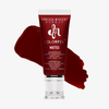 Eine Tube Danessa Myricks Beauty Colorfix Mattes in Primary Red, mit einem Muster des Farbtons dahinter.