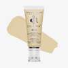Eine Tube Danessa Myricks Beauty Colorfix Nudes in der Farbnuance 2 mit einem beigen Muster im Hintergrund.