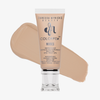 Eine Tube Danessa Myricks Beauty Colorfix Nudes in der Nuance 3 mit einem beigen Abstrich im Hintergrund.