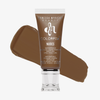 Eine Tube Danessa Myricks Beauty Colorfix Nudes in der Farbe 9 mit einem braunen Farbmuster dahinter.