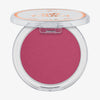 Essence soft TOUCH BOUNCY BLUSH ist ein offenes, rosafarbenes Rouge mit einem durchsichtigen Deckel und einem weißen Etikett auf der Oberseite.