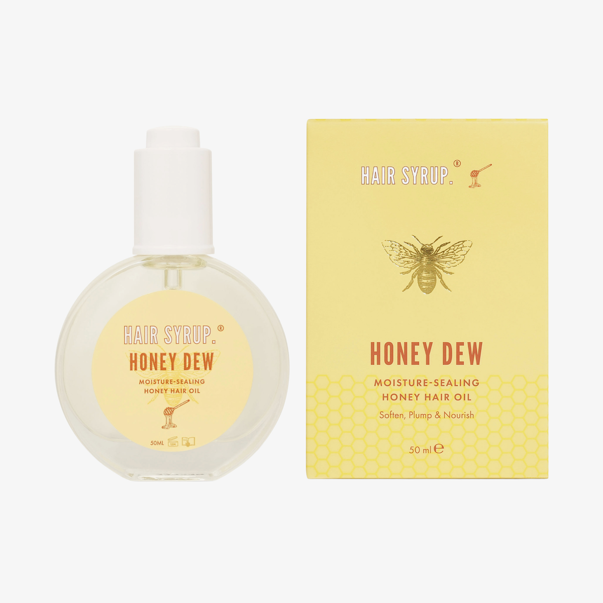 Eine Flasche und eine Schachtel Hair Syrup Honeydew Haaröl, 50ml, mit einem gelben Bienendesign.