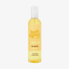 Eine gelbe Flasche Hair Syrup Lemon-Aid Pre-Wash Oil in 300ml mit einem durchsichtigen Pumpspender.