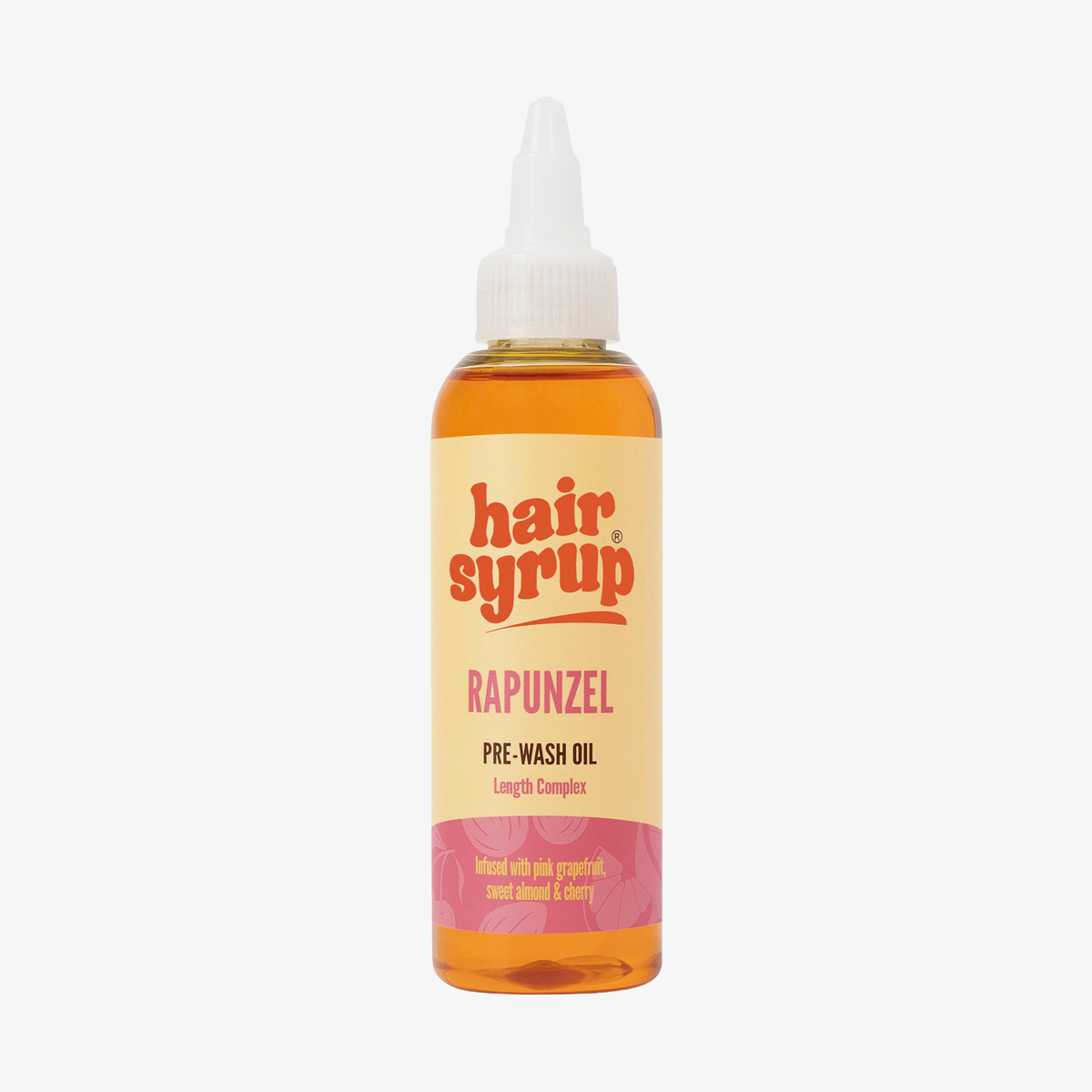 Eine Flasche Haarsirup Rapunzel, 100ml, mit einer spitzen Düse und orange-gelber Flüssigkeit.