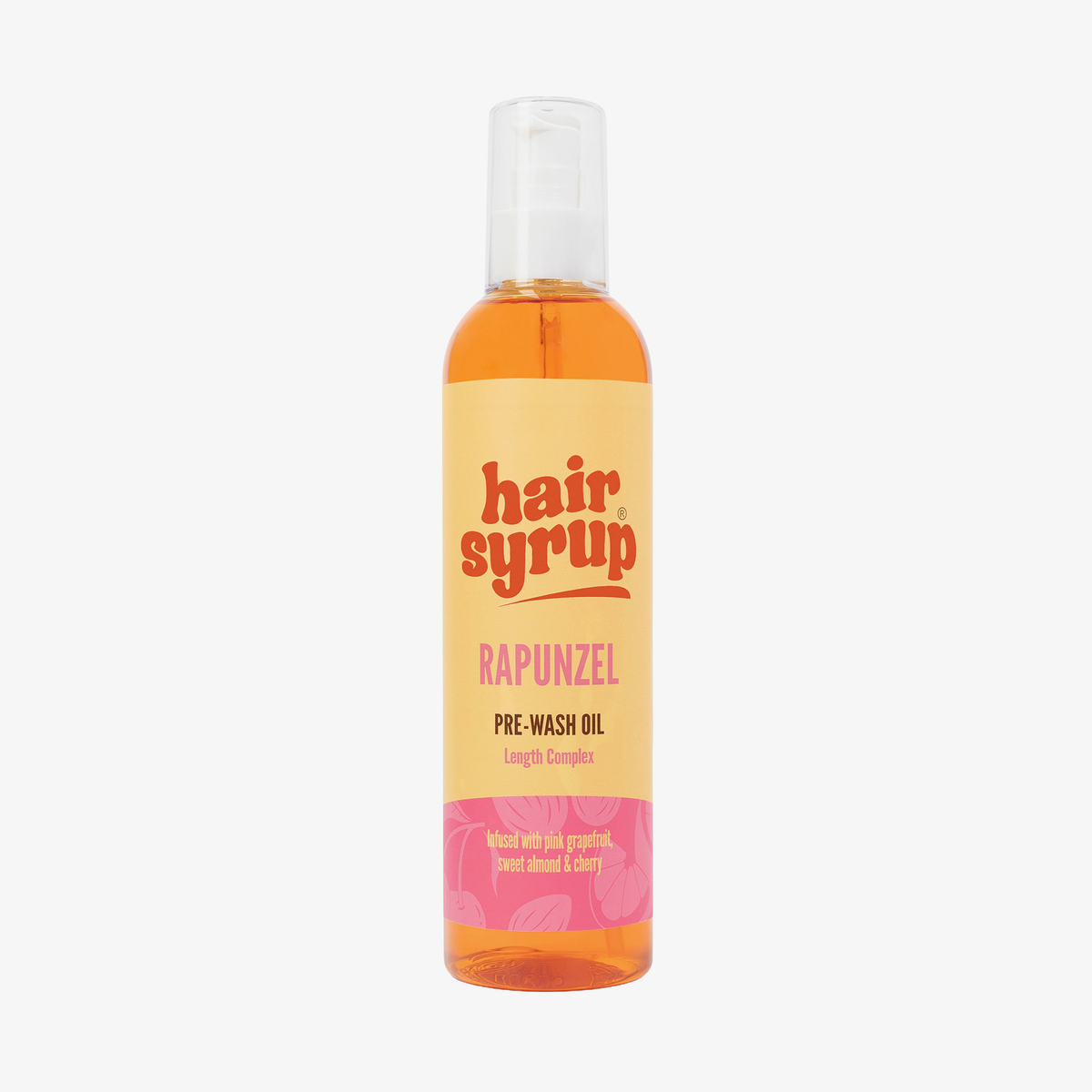 Eine Flasche Hair Syrup Rapunzel Pre-Wash Oil, 300ml, mit einem rosa-orangefarbenen Etikett ist auf weißem Hintergrund abgebildet.