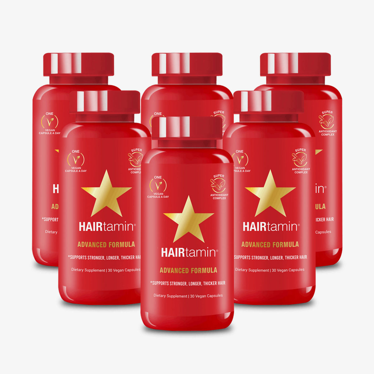 Sechs rote PURISH Kevin Testproduct Flaschen mit goldenen Sternen auf weißem Hintergrund.