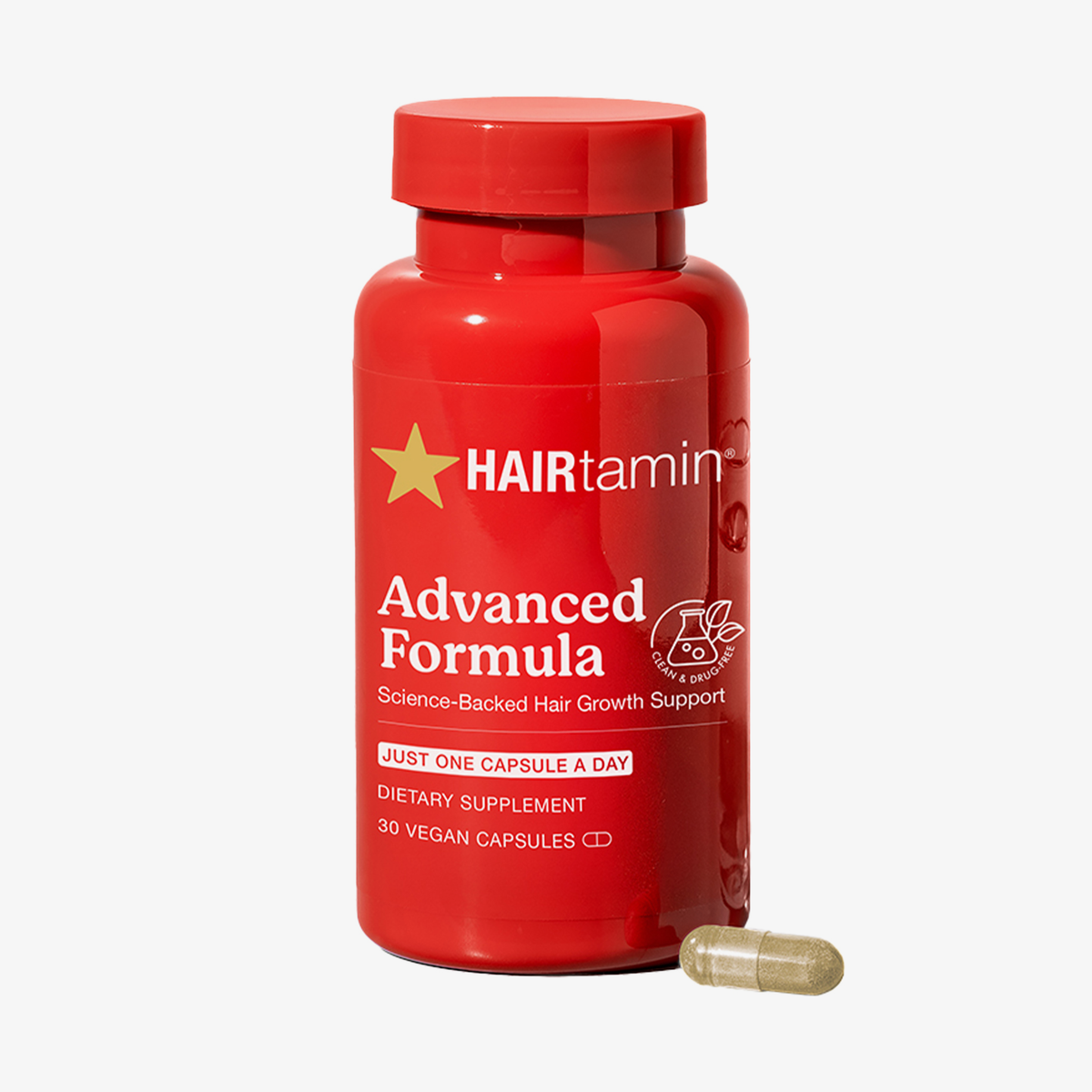 Rote Hairtamin Advanced Formula Dose mit Sternlogo, Aufschrift ‚Advanced Formula‘ und einer veganen Kapsel davor vor weißem Hintergrund.