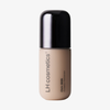 Ein beiger Flakon der Foundation „Ctrl+ SKIN“ von LH Cosmetics mit schwarzem Verschluss und der Aufschrift „Ctrl+ SKIN“.