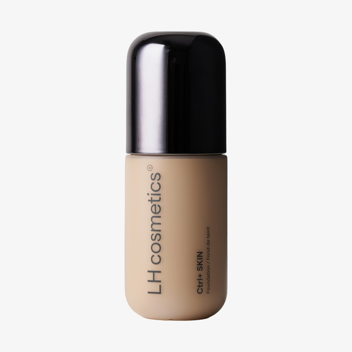 Eine beigefarbene Flasche der „Ctrl+ SKIN“-Foundation von LH Cosmetics mit schwarzem Verschluss vor weißem Hintergrund.