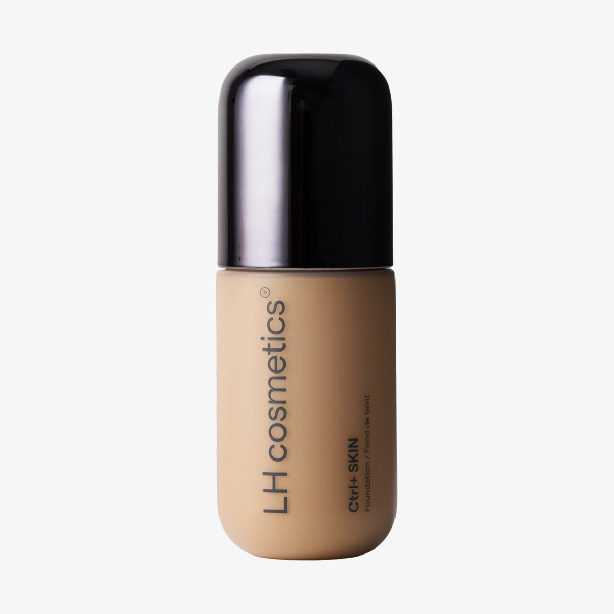 Ein beiger Flakon der „Ctrl+ SKIN Foundation“ von LH Cosmetics mit schwarzem Verschluss, beschriftet mit „Ctrl+ SKIN Foundation“.