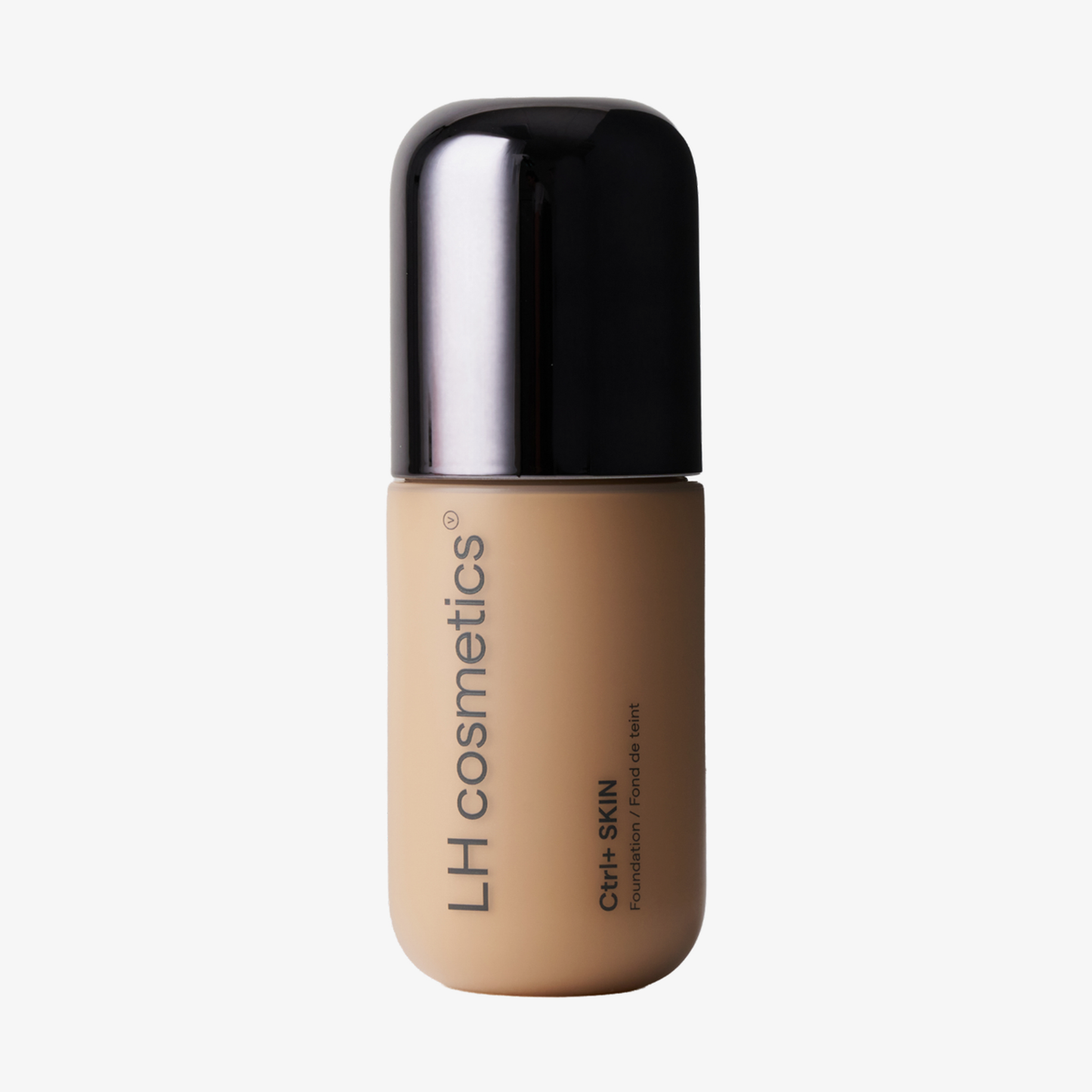 Eine Flasche „Ctrl+ SKIN“-Foundation von LH Cosmetics mit beigem Flakon und schwarzem Verschluss.