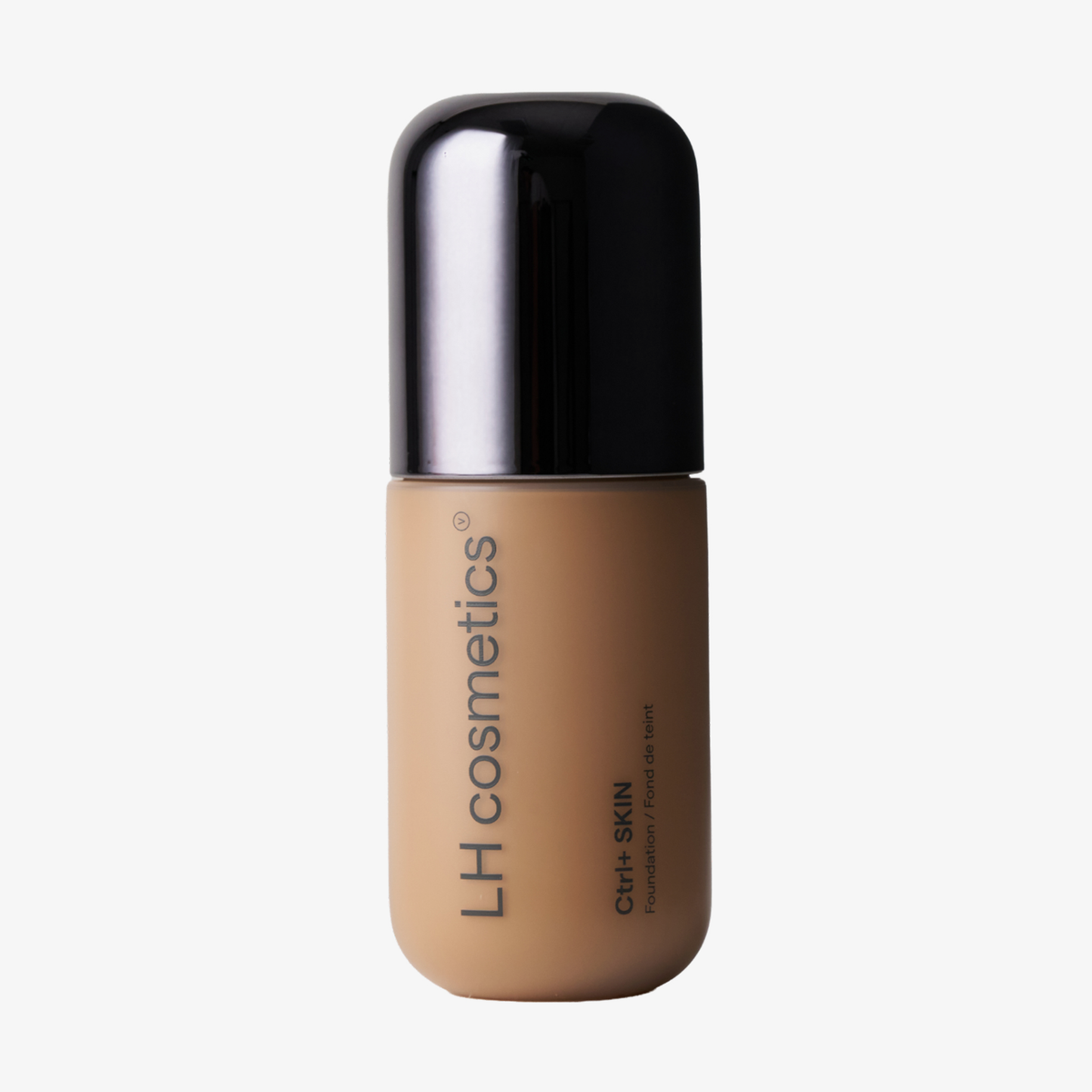Eine Flasche „Ctrl+ SKIN“-Foundation von LH Cosmetics mit schwarzem Verschluss und beiger Flüssigkeit, vor einem schlichten weißen Hintergrund.