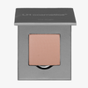 Ein einzelnes Pfirsichpuder in einer quadratischen grauen Puderdose von LH Cosmetics, genannt The single.