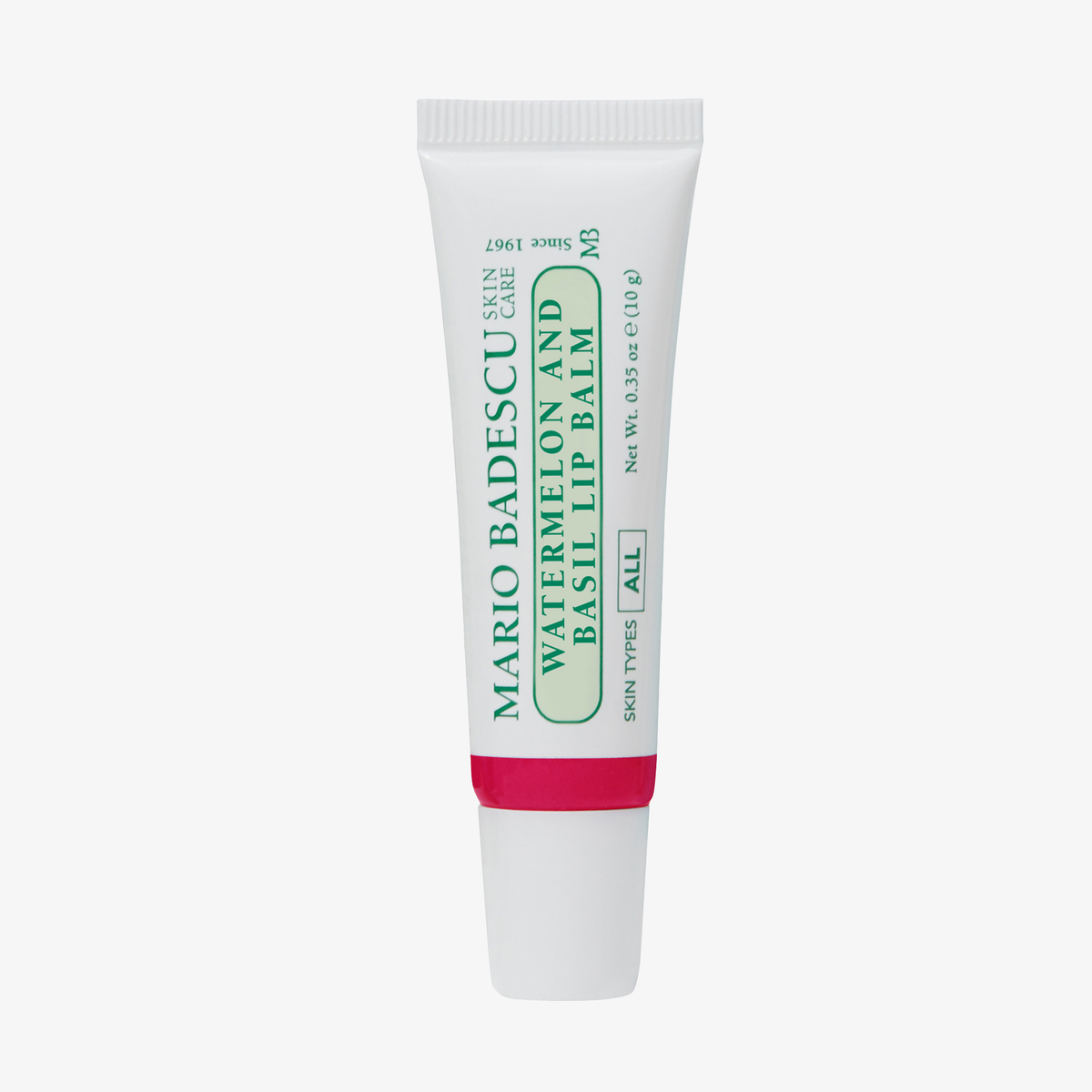 Eine Tube Mario Badescu Granatapfel- und Guaven-Lippenbalsam auf weißem Hintergrund.