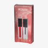 Ein COSMIC KISS CHRISTMAS KIT von Mesauda Beauty mit zwei Lippenprodukten in einer roten, rechteckigen Schachtel mit Sternenmotiv.
