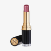Beyond Jelly Lipstick Perlati Crystal Mauve von NABLA Cosmetics in einer gold-schwarzen Tube, aufrecht mit der Kappe daneben abgebildet.