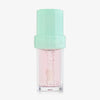 Lip Candy Oil in Watermelon von NABLA in transparenter Verpackung mit mintgrünem Deckel und glänzender leicht rosaner Textur.