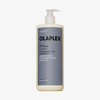 Eine Flasche OLAPLEX N°4 CURLBond Shaper Hydrating Curl Shampoo mit Pumpspender vor weißem Hintergrund.