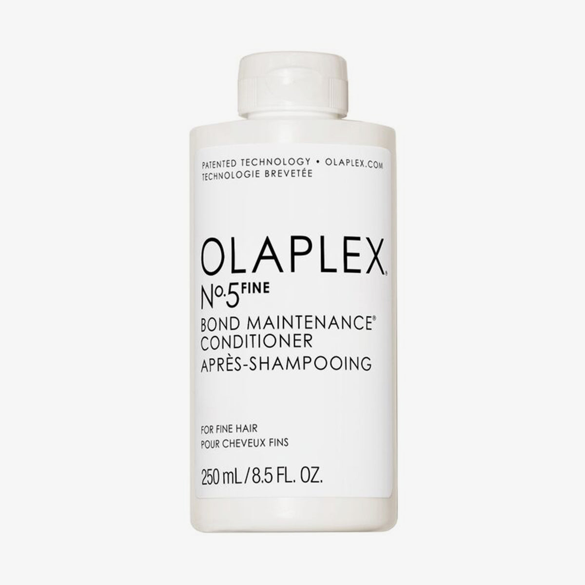Weiße Flasche OLAPLEX N°5 FINE Bond Maintenance Conditioner mit schwarem Text vor weißem HIntergrund.