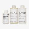 OLAPLEX Total Hair Repair Holiday Kit 2026 mit drei Flaschen: Pflegeprodukt Nr. 3, Shampoo Nr. 4 und Spülung Nr. 5.