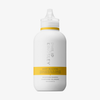 Eine weiße Flasche „Philip Kingsley Body Building Shampoo“ mit einem durchsichtigen Klappverschluss und gelben Akzenten auf dem Etikett.