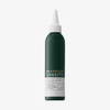 Eine grüne Flasche des „Philip Kingsley Density Stimulating Scalp Toner“ mit einem weißen, spitzen Verschluss vor einem einfarbigen Hintergrund.