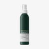 Auf weißem Hintergrund ist ein grünes Philip Kingsley Density Thickening Protein Spray mit weißem Verschluss abgebildet.