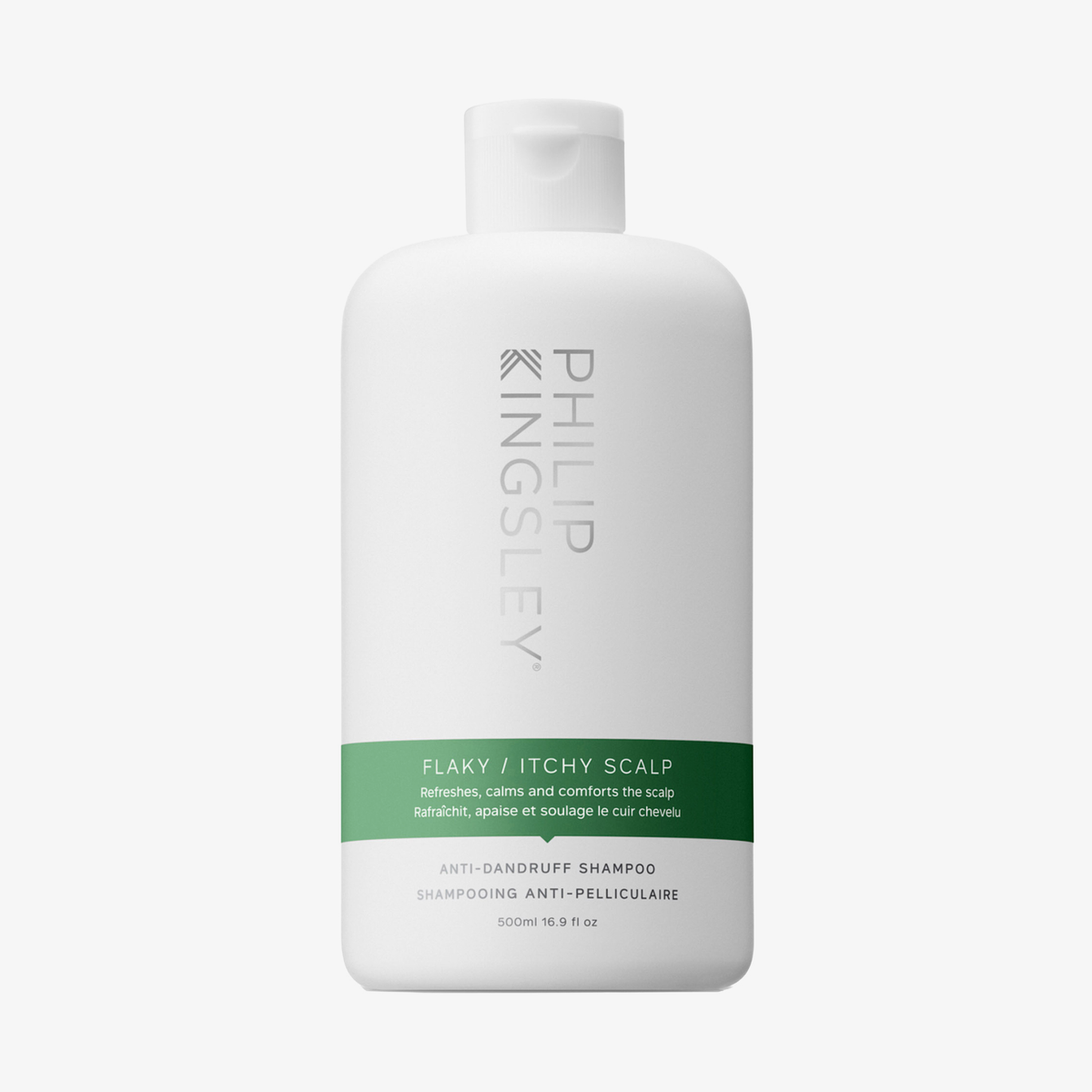 Philip Kingsley Shampoo gegen schuppige, juckende Kopfhaut in einer weißen Flasche mit grünem Etikett, abgebildet vor einem einfarbigen Hintergrund.