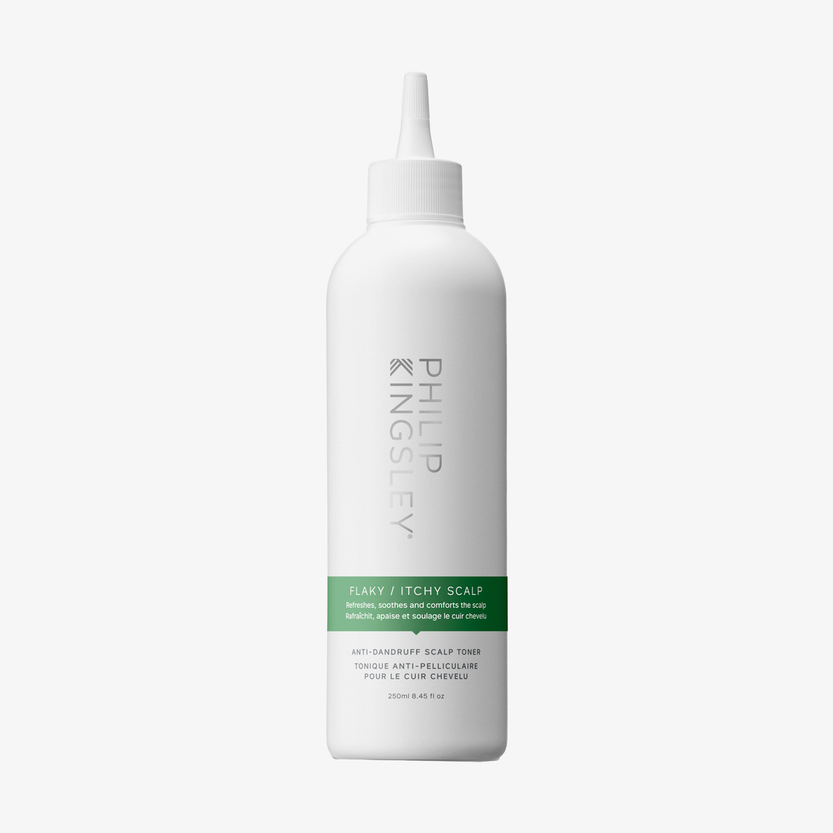 Eine weiße Flasche „Philip Kingsley Flaky Itchy Scalp Toner“ mit einer spitzen Düse und einem grünen Etikett.
