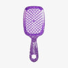 Die UNbrush Detangling Hair Brush ist eine violette, glitzernde Bürste mit einem wabenförmigen, belüfteten Paddel und einem Markengriff.