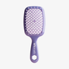 Eine lilafarbene UNbrush Detangling-Haarbürste mit weißen Borsten und dem Schriftzug UNbrush" auf dem Griff.