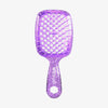 Die UNbrush Detangling Hair Brush Mini ist eine glitzernde lilafarbene Bürste mit einem belüfteten Paddel mit Wabenmuster und einem ergonomischen Griff.