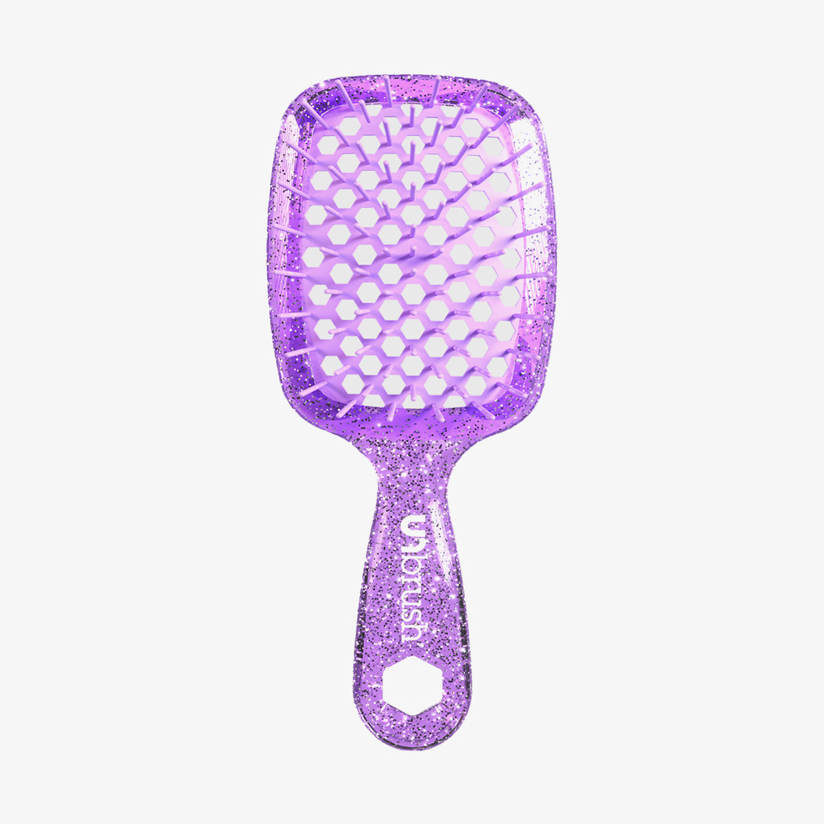 Die UNbrush Detangling Hair Brush Mini ist eine glitzernde lilafarbene Bürste mit einem belüfteten Paddel mit Wabenmuster und einem ergonomischen Griff.