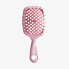 Eine rosafarbene Detangling Hair Brush Mini von UNbrush mit einem wabenförmigen, belüfteten Paddel und dem Markennamen auf dem Griff.