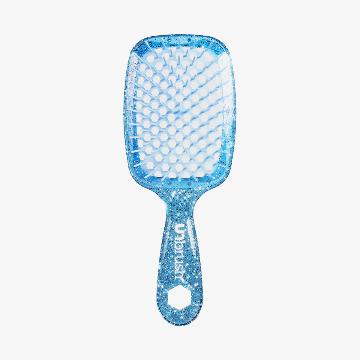 Die blau giltzernde UNbrush Detangling Hair Brush hat einen wabenförmigen Bürstenkopf mit dem Schriftzug "UNbrush" auf dem Griff.