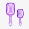 Das UNbrush Glitter Duo Set Amethyst Lavender enthält zwei lilafarbene, glitzernde Haarbürsten, eine große und eine kleine, jeweils mit dem UNbrush-Logo auf dem Griff.