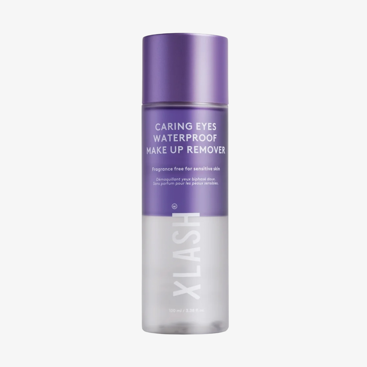 Eine Flasche „XLASH Caring Eyes Waterproof Make-Up Remover“ mit violettem Verschluss und Etikett.